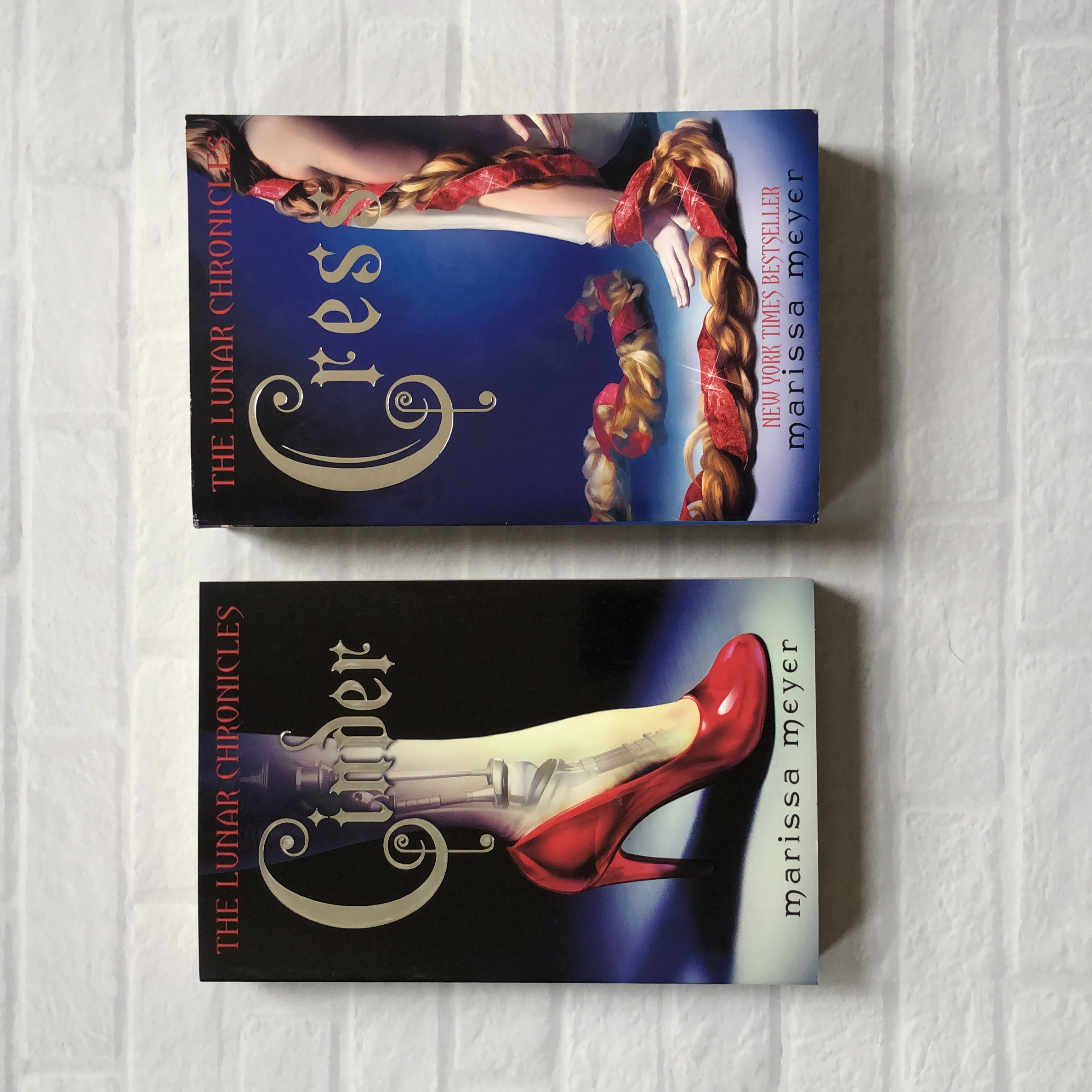 Cinder & Cress (UK paperbacks, lot of 2)