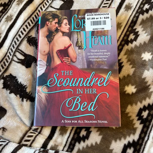 The Scoundrel in Her Bed