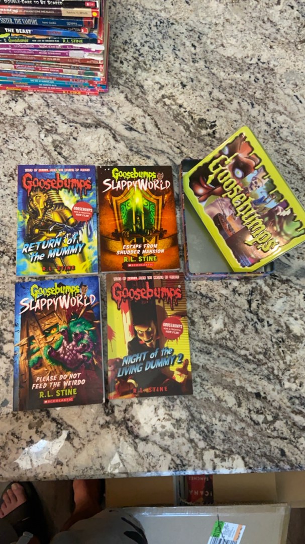 4 Goosebumps books and collector tin box (empty box) 