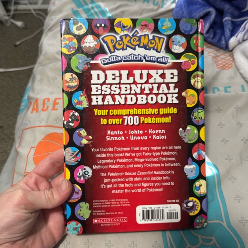 Pokemon deluxe essential handbook by Scholastic , Hardcover | Pangobooks