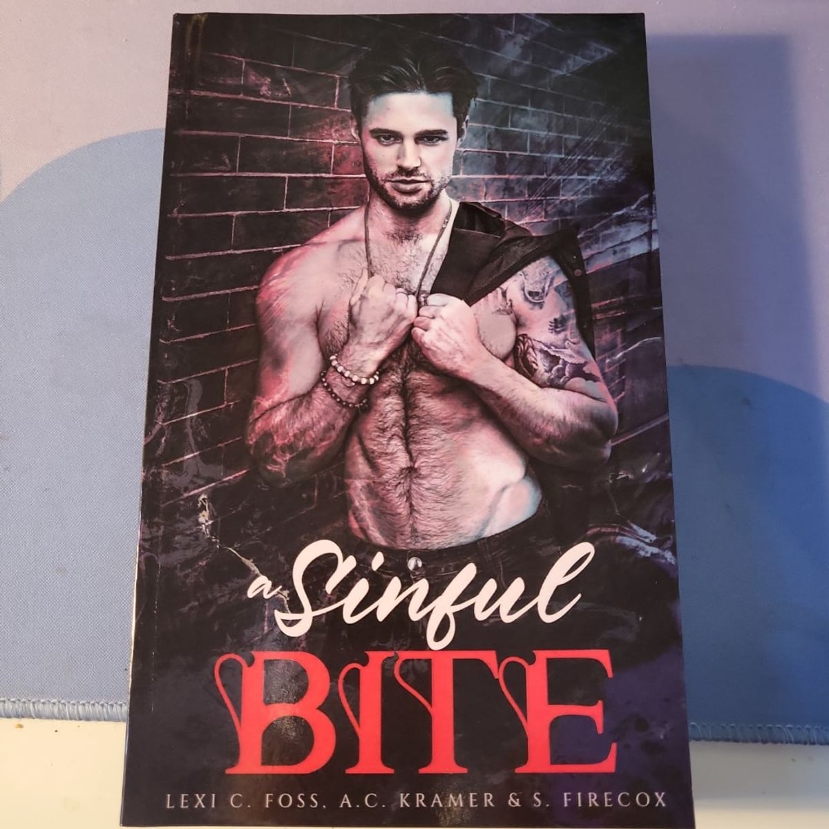 A Sinful Bite by Lexi C. Foss, A. C. Kramer, S. Firecox