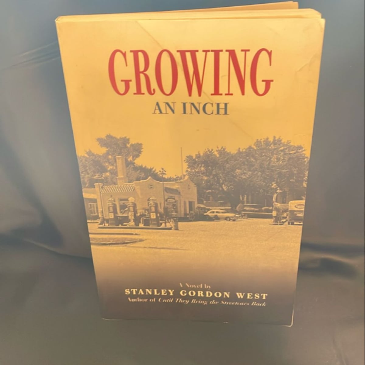 Growing an Inch by Stanley Gordon West, Paperback | Pangobooks