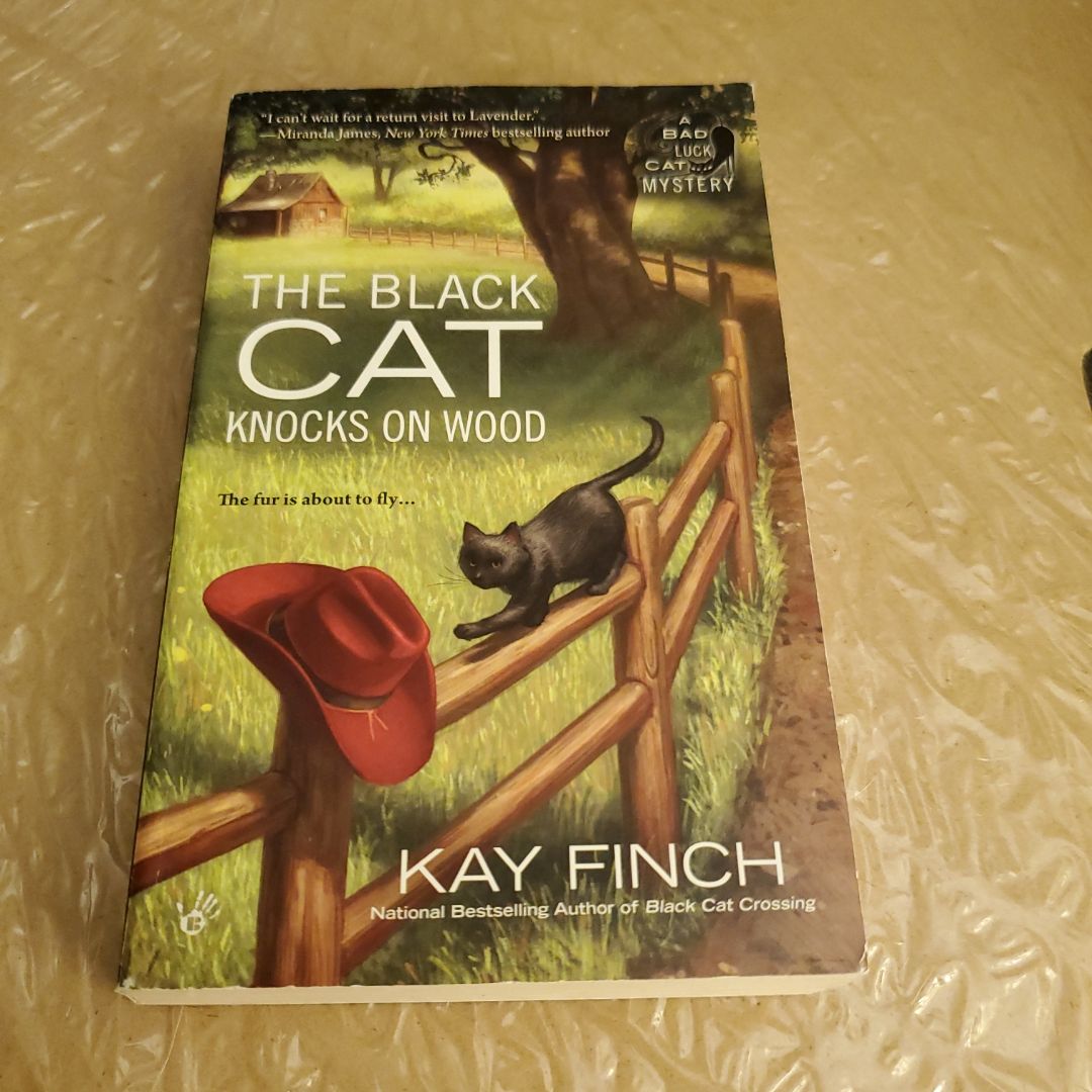 The Black Cat Knocks On Wood