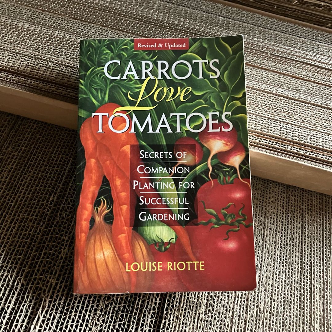 Carrots Love Tomatoes and Roses Love Garlic