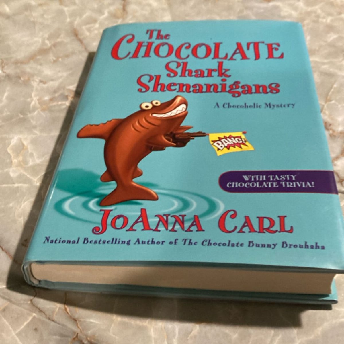The Chocolate Shark Shenanigans by JoAnna Carl, Hardcover | Pangobooks
